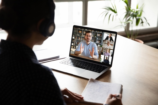 a person looking at a laptop